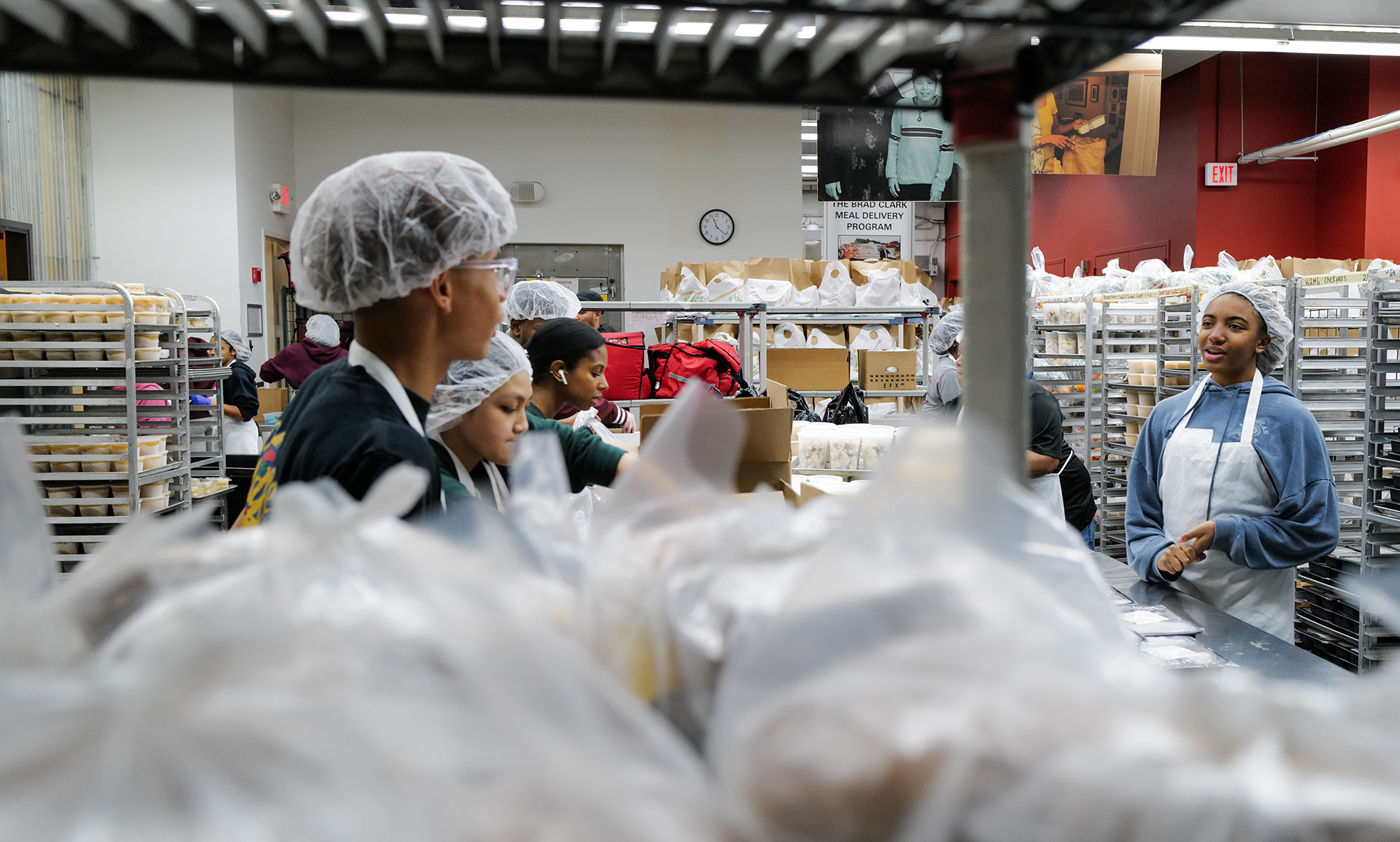 Food & Friends volunteers pack food amid supply chain shortages in 2023 - photo by Ralph Alswang