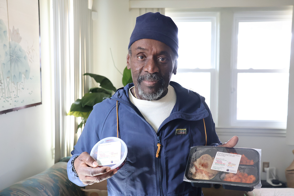 Howard Wright holds medically tailored meals